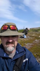 During a work visit to a known eroding site this summer, 2015. I am taking photos and dad is surface collecting artifacts from an eroding site.